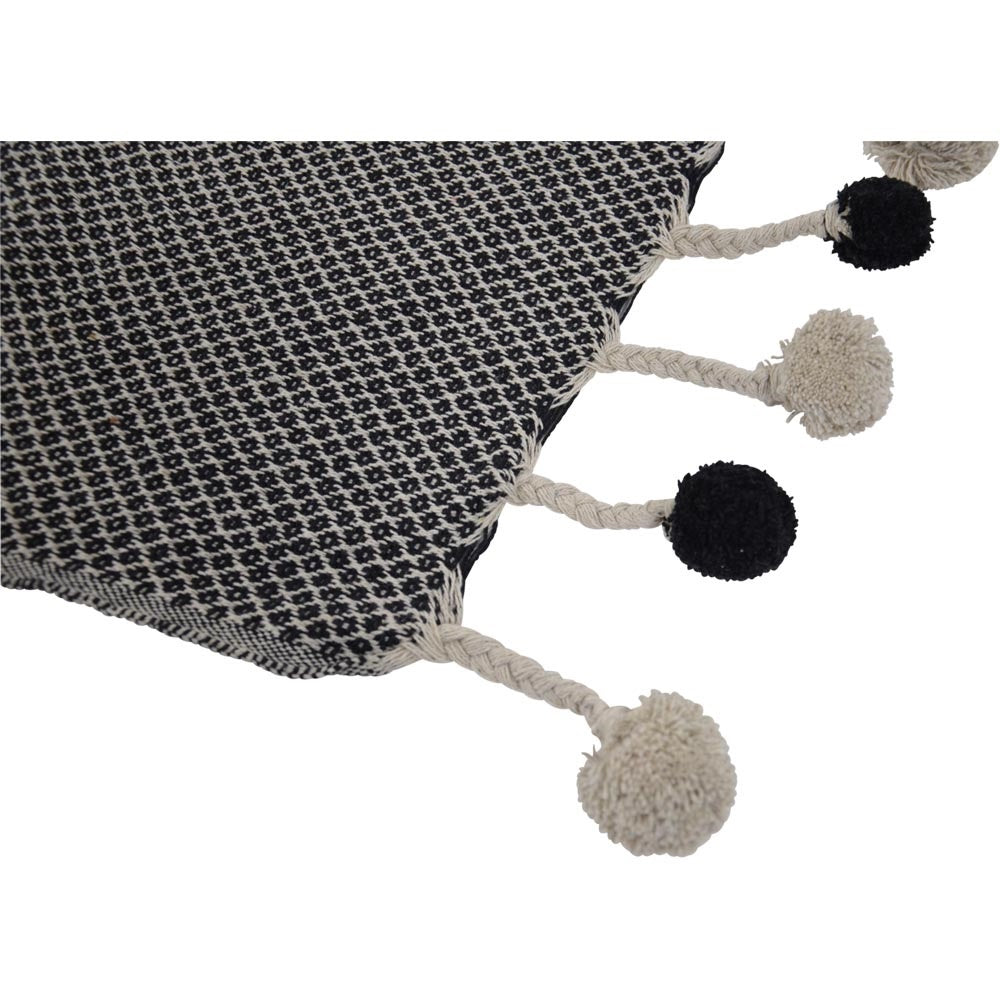 Zwart-witte ruitplaid met beige en zwarte pompons aan de hoekrand
