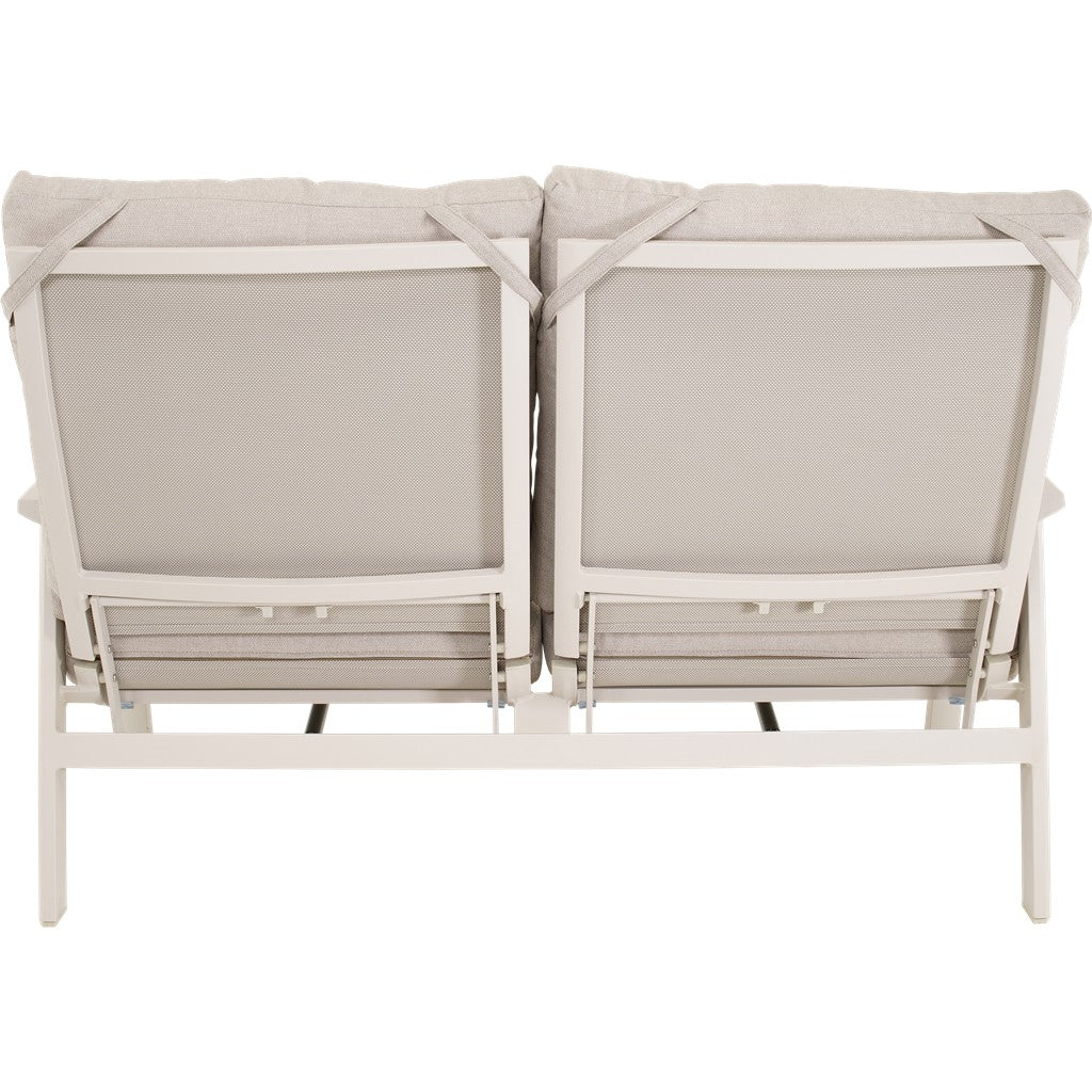 Achteraanzicht met open constructie van crème loungebank, wit frame en stoffen bekleding