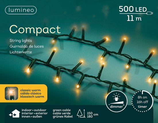 Compacte kerstverlichting met warmwitte LED-lampjes op donker groene kabel