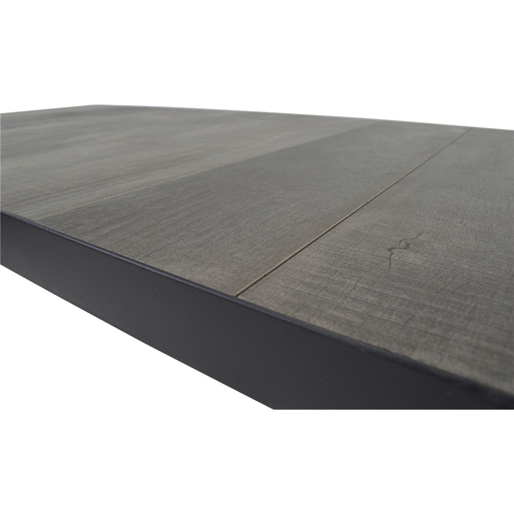 Zwarte eettafel met grijs blad, zichtbare naad langs de rand