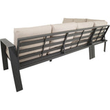 Loungehoekset bankgedeelte met donkergrijs lattenrug en lichtbeige kussens