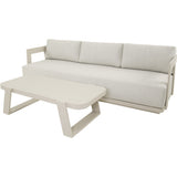 Loungebank met lichtbeige kussens en lage rechthoekige tafel, witte poten
