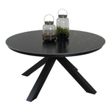 Ronde eettafel met donker blad en zwarte driepoot, met glazen flessen erop