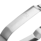 Westmark dunschiller: close-up van roestvrijstalen mes met logo