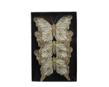 Vlinderornament met gouden glitter en gevederde vleugels
