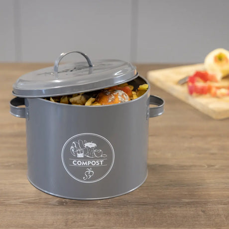 Keukencomposter antraciet met open deksel en COMPOST-logo; bak met etensresten.