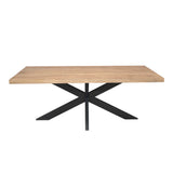 Eettafel met licht houten blad en centraal zwart kruispoot-onderstel