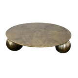 Ronde salontafel met goudkleurig blad en drie dikke ronde pootjes