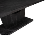 Zwarte eettafel: close-up van het centrale onderstel en de bladrand.