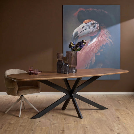 Ovale eettafel met bruin houten blad en zwart metalen kruisvormig pootonderstel.