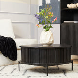 Ronde salontafel met zwarte, geribbelde zijkant en zwart blad op smalle pootjes