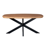 Ovale eettafel met naturel blad en zwarte kruisvormige poten, vooraanzicht.