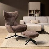 Paars fauteuil met armleuningen en zwarte draaivoet, plus poef met ronde zitting.