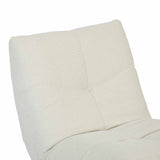 Relaxfauteuil met lichtbeige stof, zijprofiel van rug en zitting met zichtbare naden