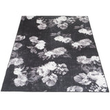 Zwart vloerkleed met grote witte bloemen