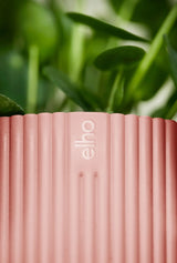 Roze potrand met verticale ribbels en elho-logo in reliëf.