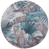 Rond vloerkleed met palmbladmotief in groen, blauw en grijs op licht ondergrond