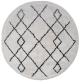 Rond vloerkleed in crèmekleur met donkerblauw ruitpatroon en grafische lijnen