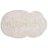 Beige wasbaar vloerkleed met golvend reliëfpatroon, ovaal uitzicht