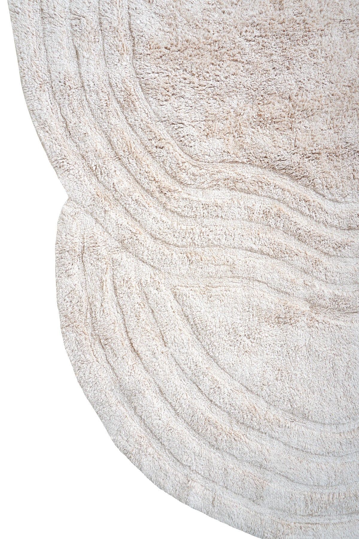 Beige wasbaar vloerkleed, close-up van golvend reliëf met microstructuur